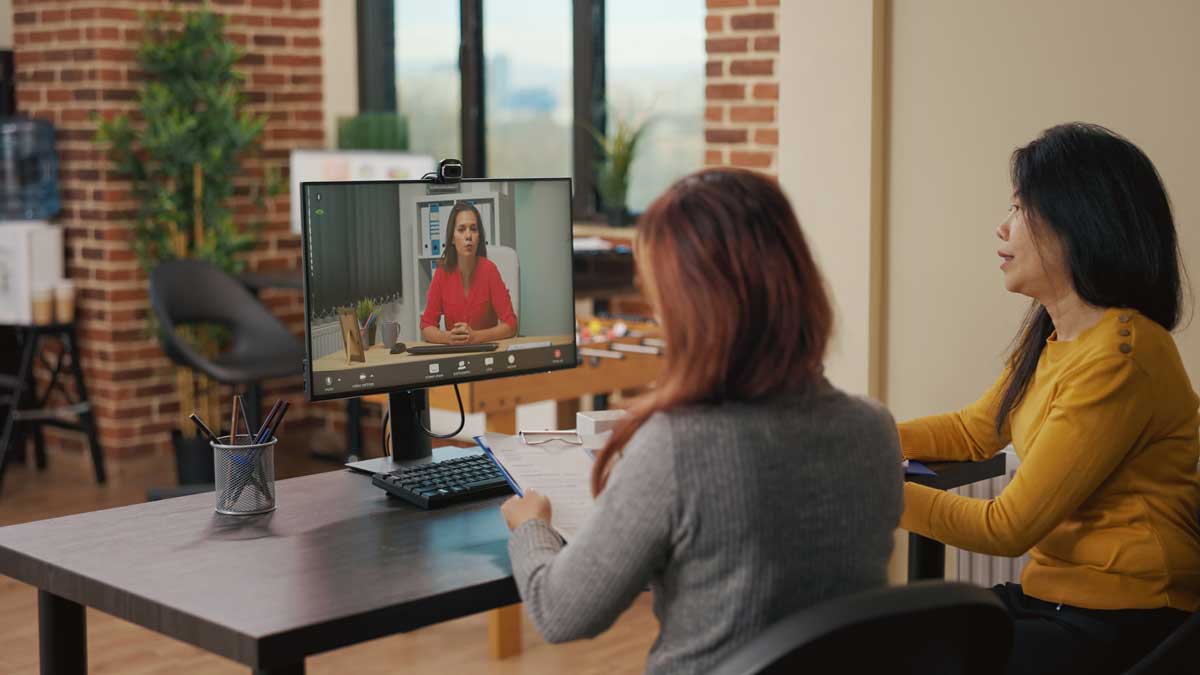 team of women using video conference call for job interview