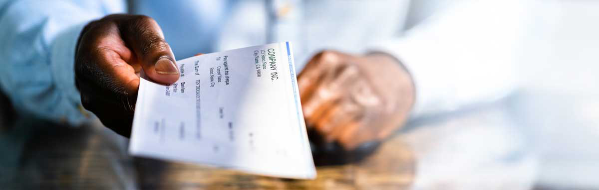 man holding paycheck